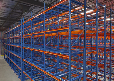 Three-deep back-to-back pushback racking at Mevotech, floor-mounted first level, six levels high, for auto parts storage in custom pushback colours.