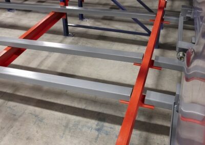 Back-to-back pushback racking configuration featuring a shared rear beam to reduce upright and beam requirements.