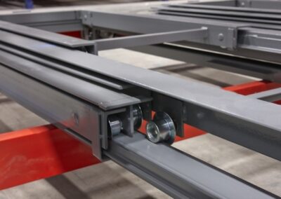 Close-up of nested low-profile carts in a six-deep structural pushback racking system at Chapmans Ice Cream, operating in a -40°C freezer.