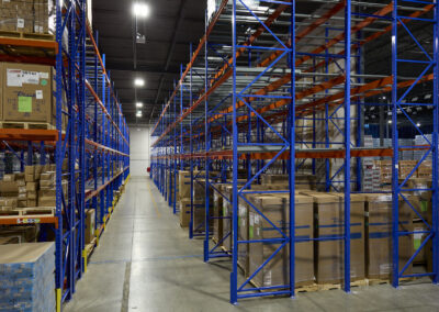 Four-deep pushback racking at GBT Logistics, with floor storage on the first level and three levels of pushback above.